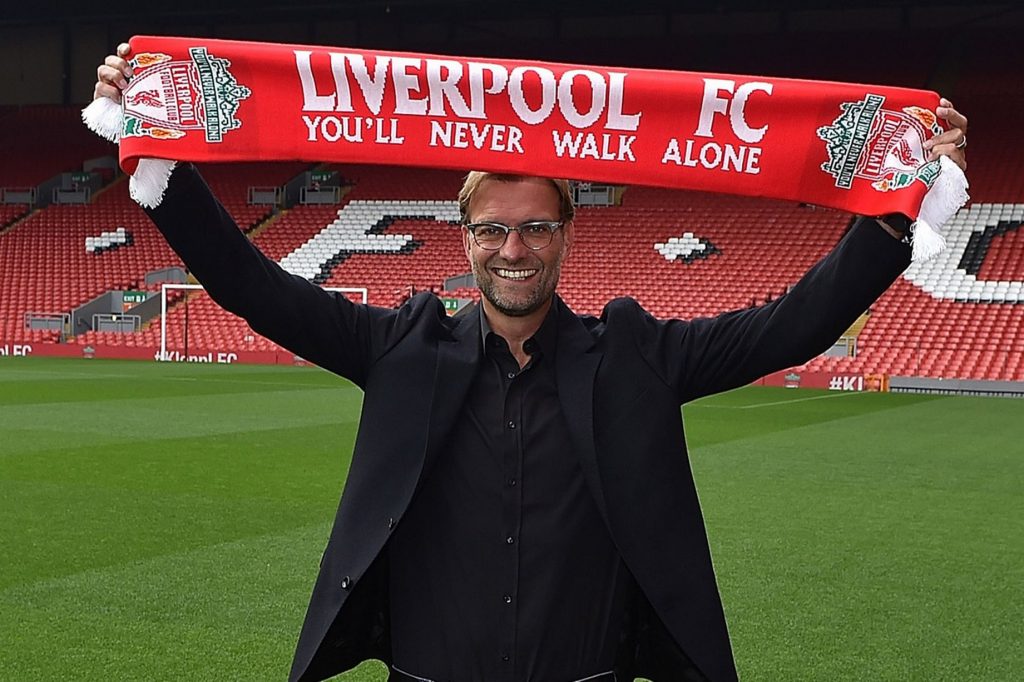 Jurgen-Klopp-new-manager-of-Liverpool-at-Anfield-holds-up-a-scarf
